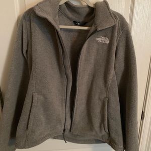 gray North Face zip up jacket